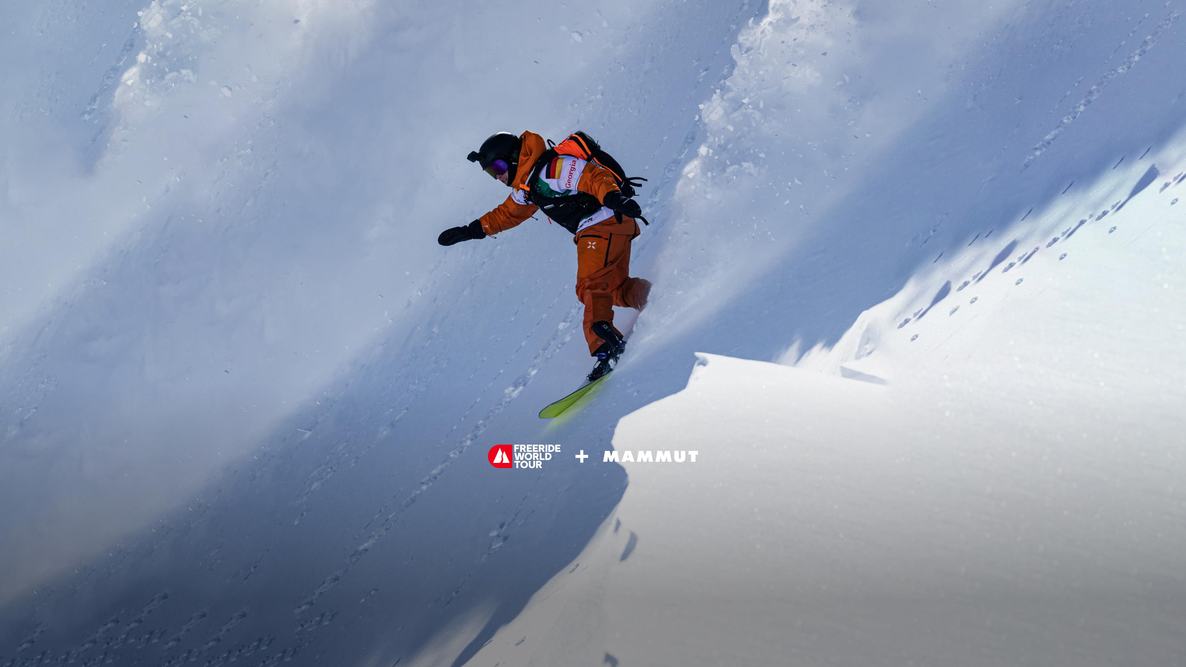 Skier making a sharp turn on a steep snowy slope, leaving a trail of snow, showcasing Mammut gear during the Freeride World Tour.