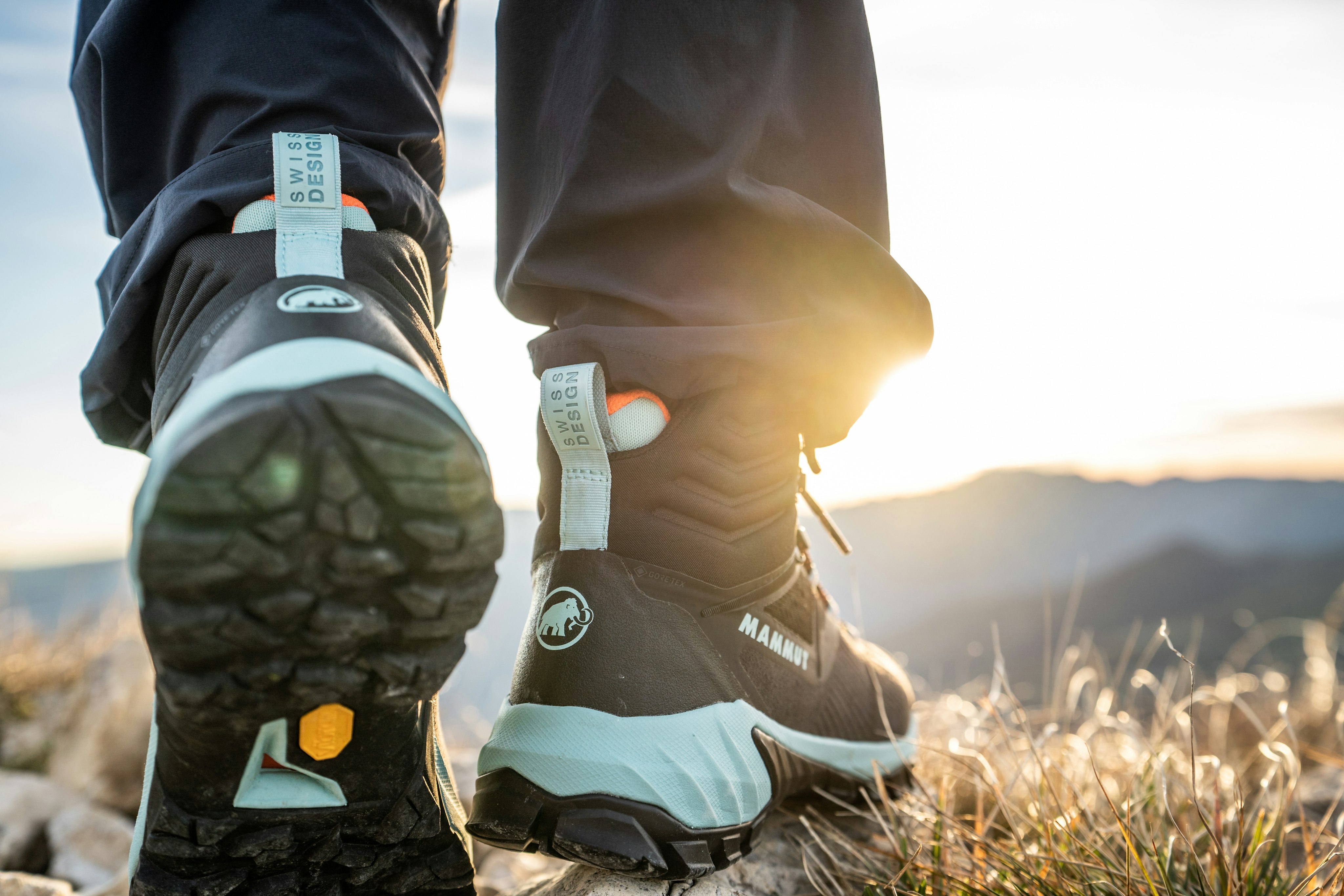 Mammut shoes with a mountain panorama.