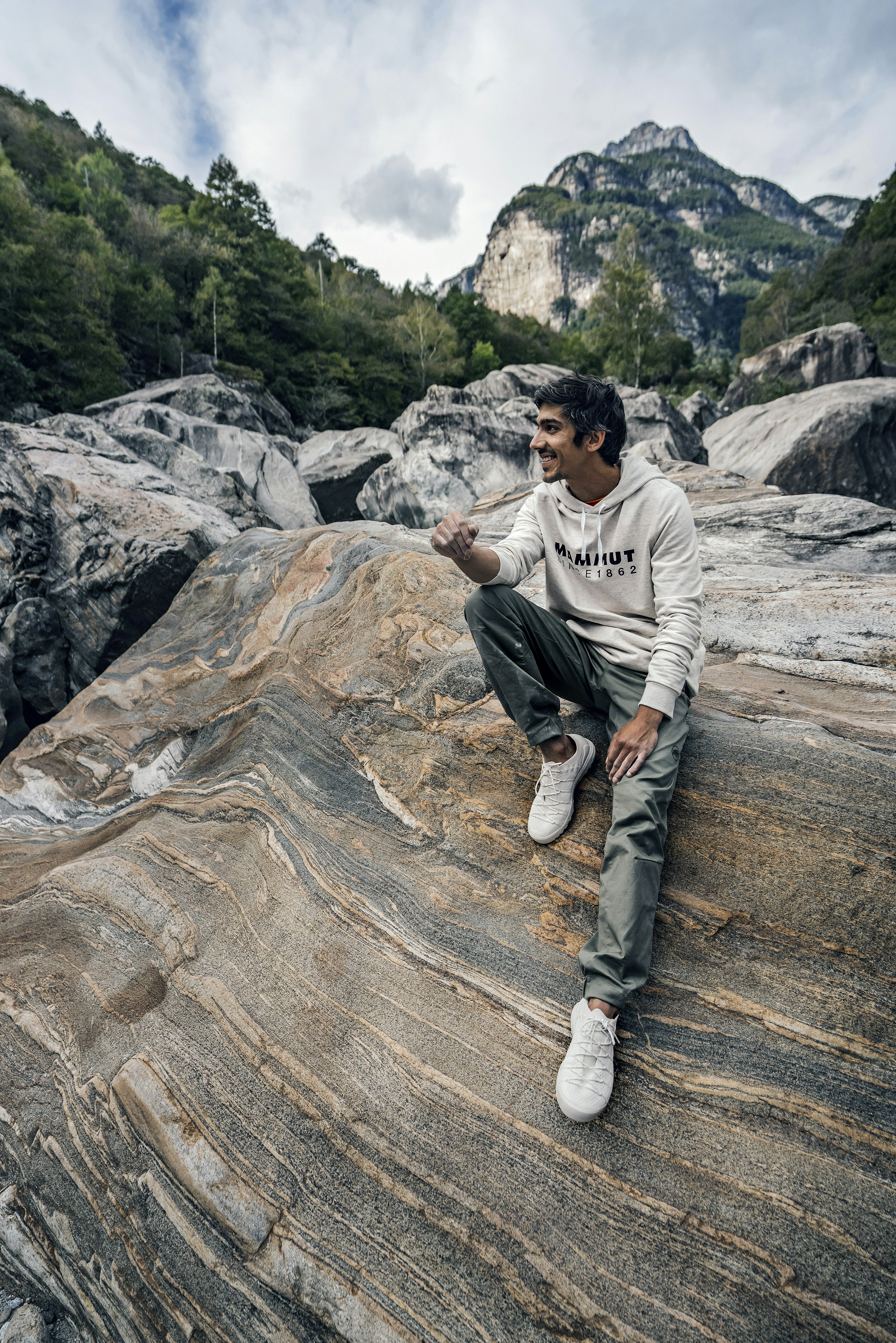 Man sitting on a rock.