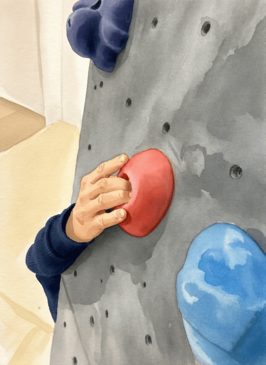 A man climbing a wall grips a hold labeled "pocket" with his fingers, showcasing climbing gear from Mammut.