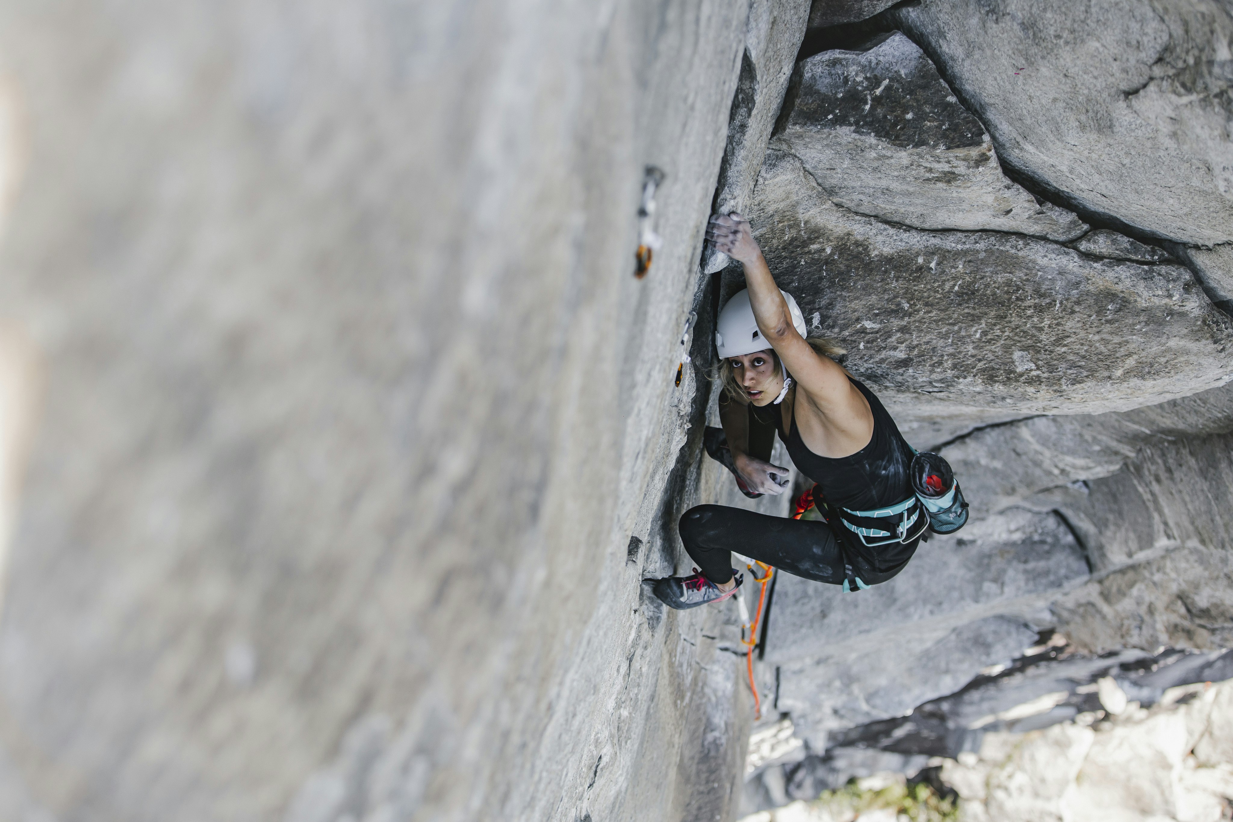 Woman climbing on a rock wall