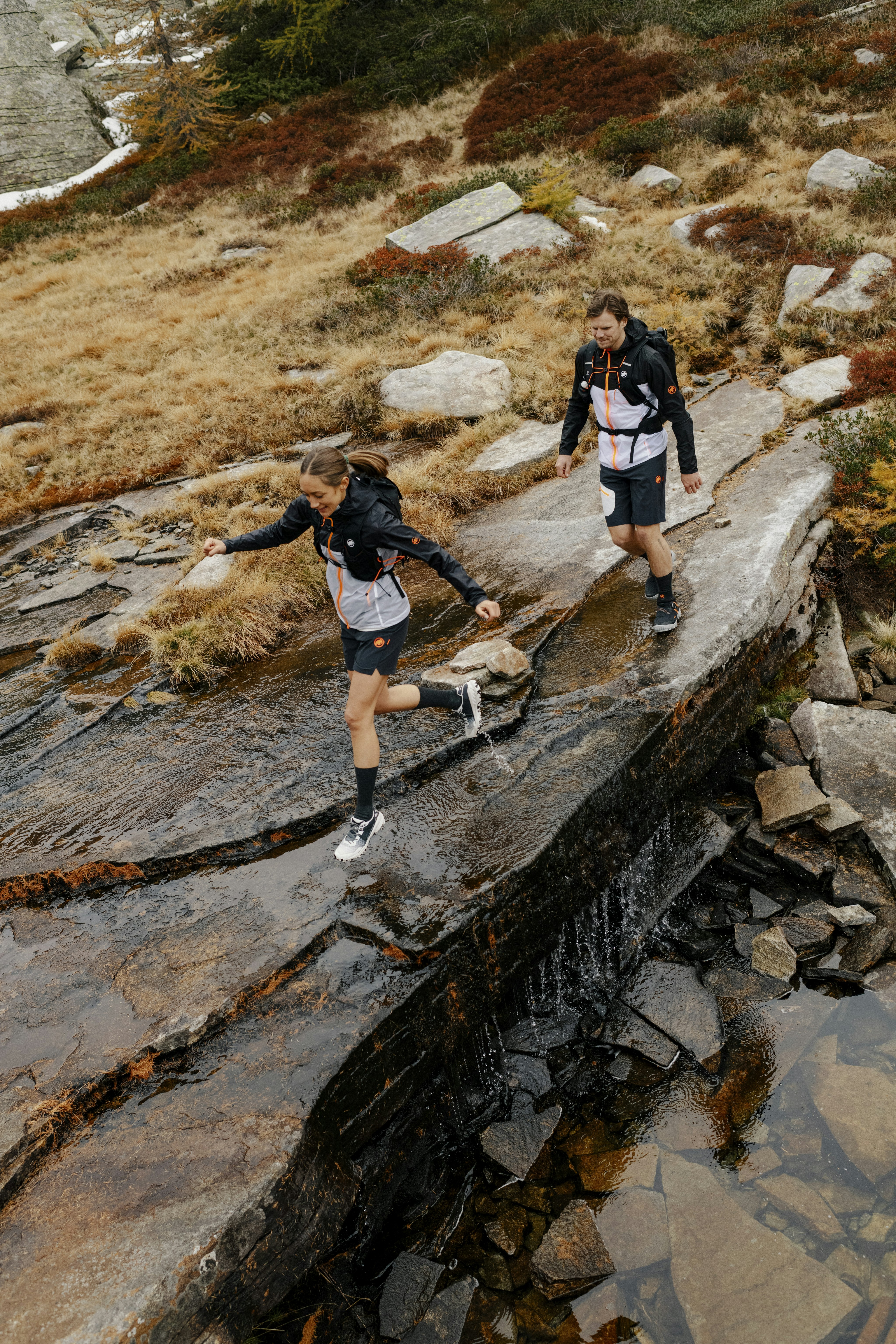 Two runners on a stream