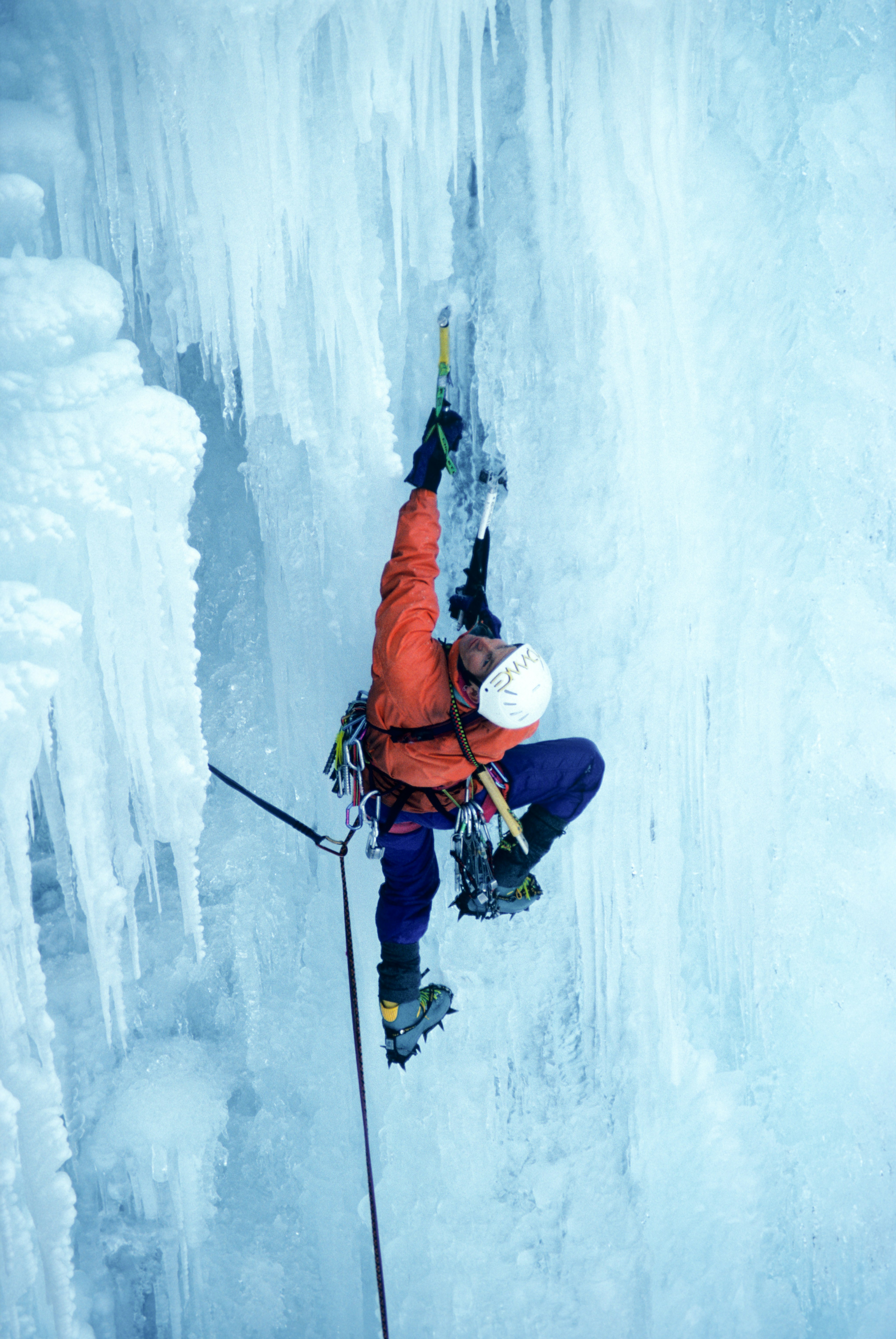 Climbing on the ice cliff