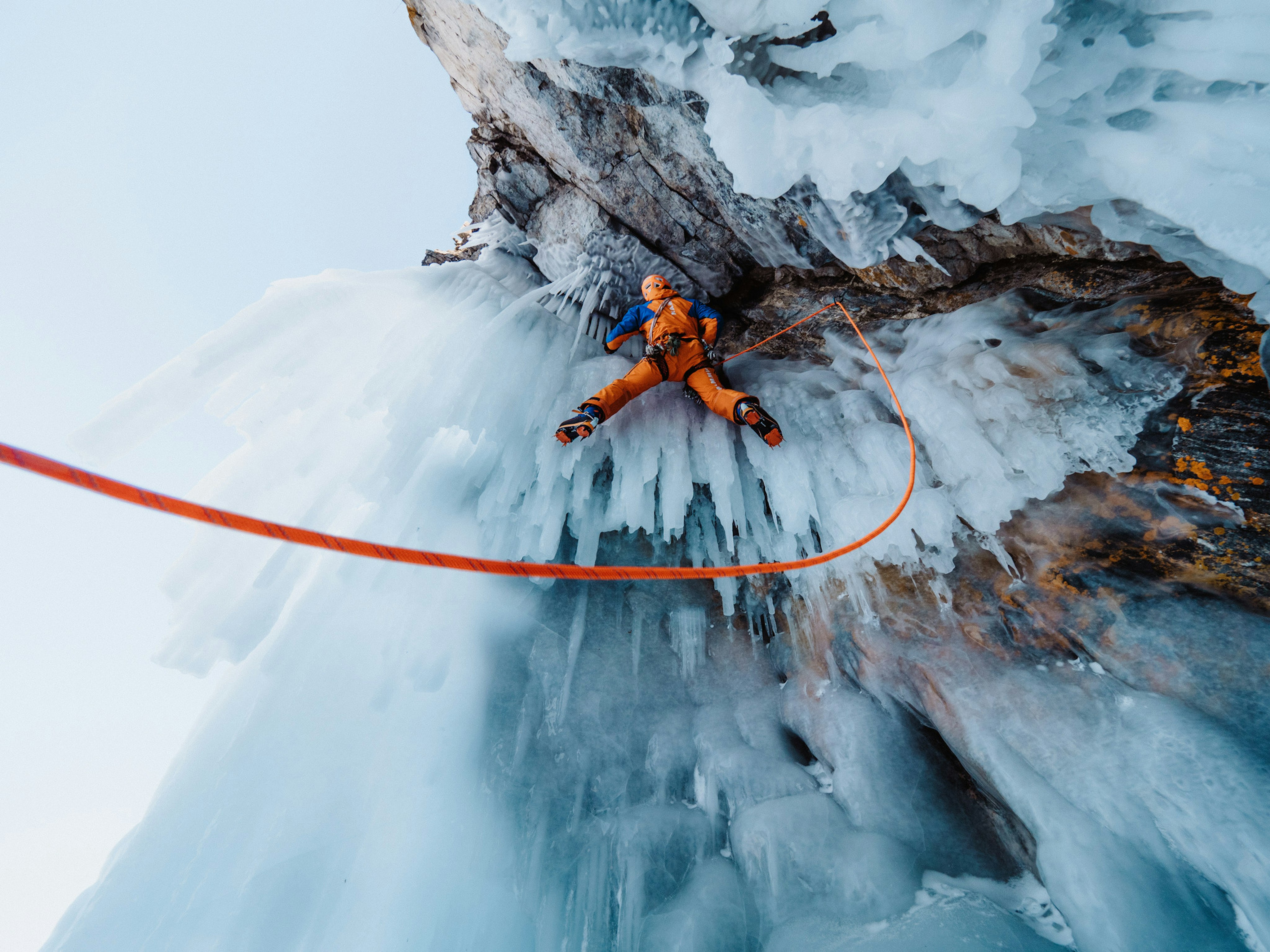 Person is ice climbing 