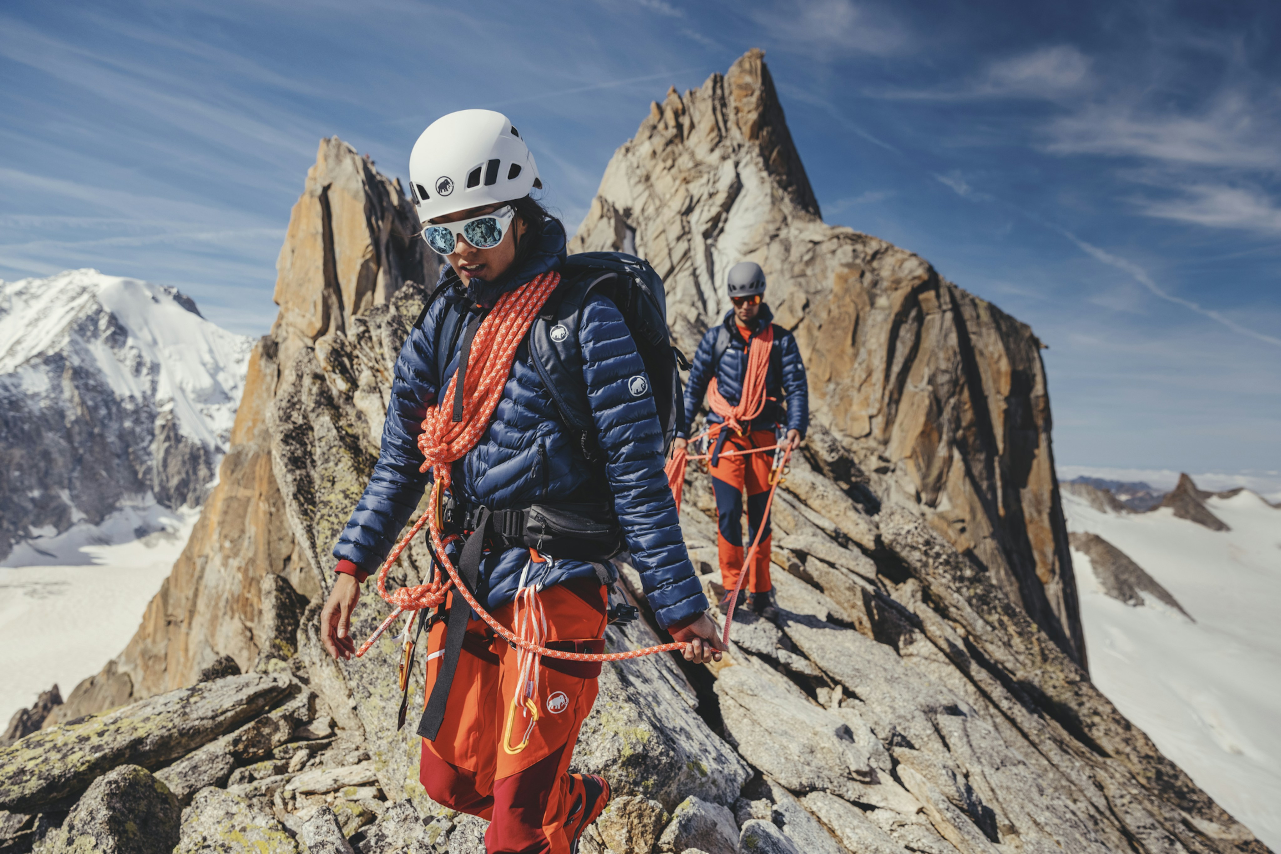 Two athletes in Mammut mountaineering outfit from the 2022 collection.