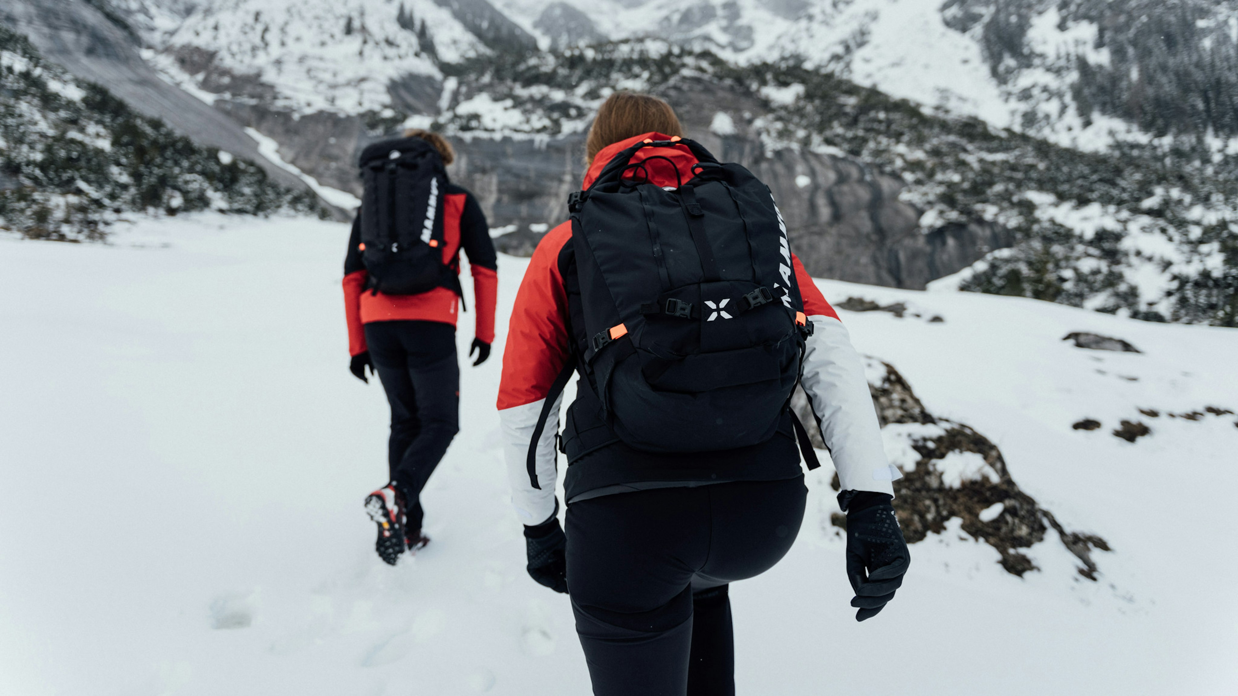 Two people in Mammut Outfit 