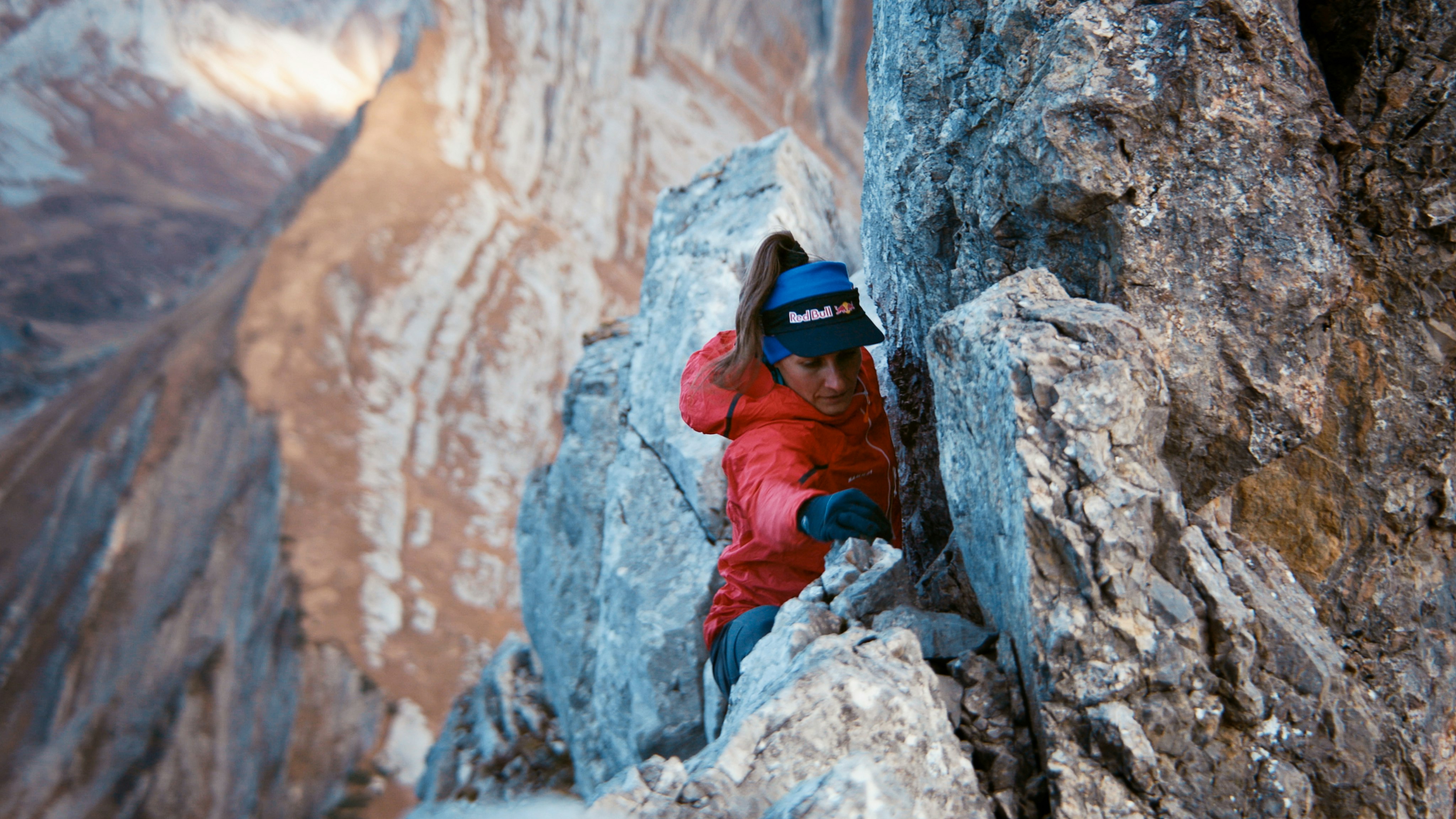 Nadine climbing in Mammut clothes