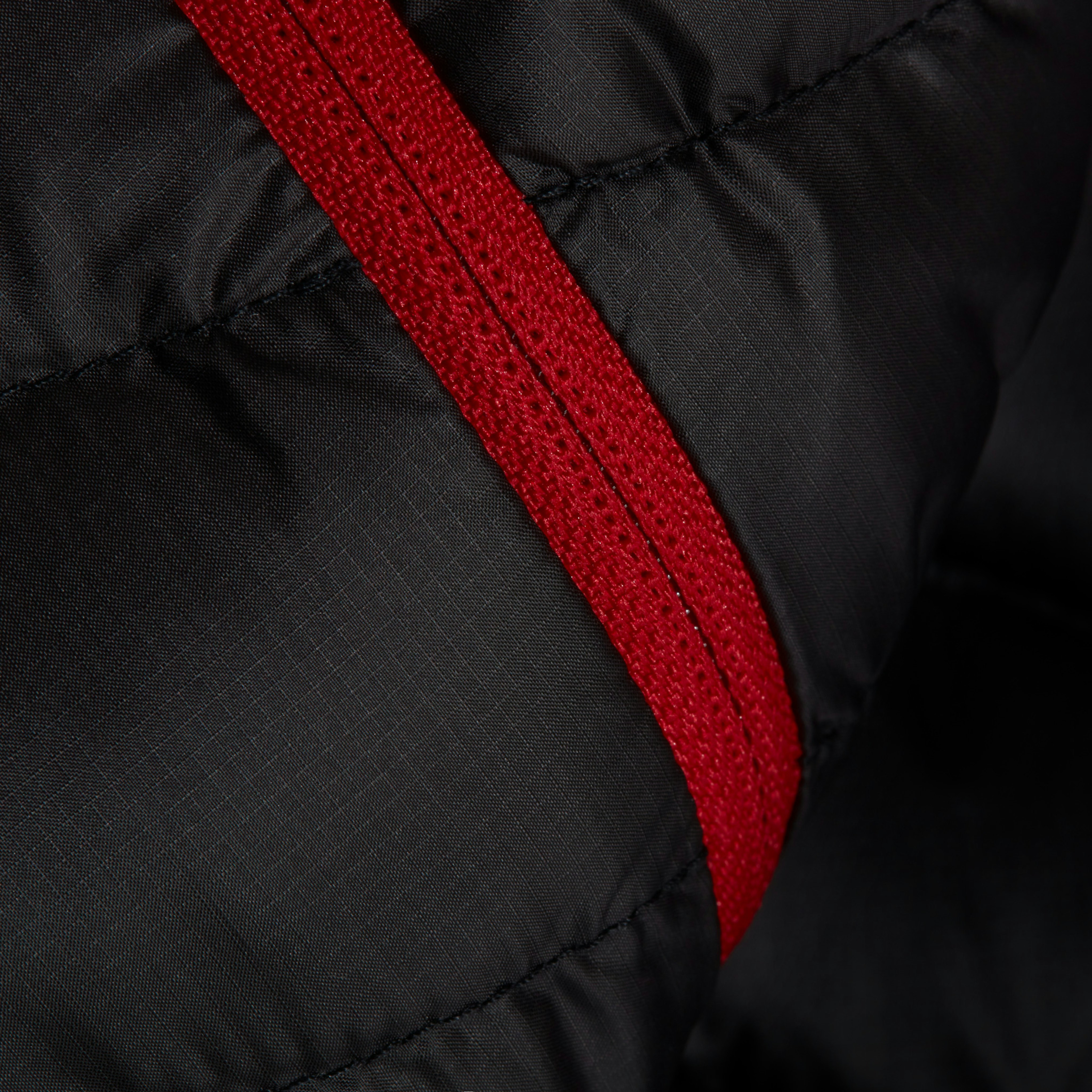 Black fabric with red zipper 
